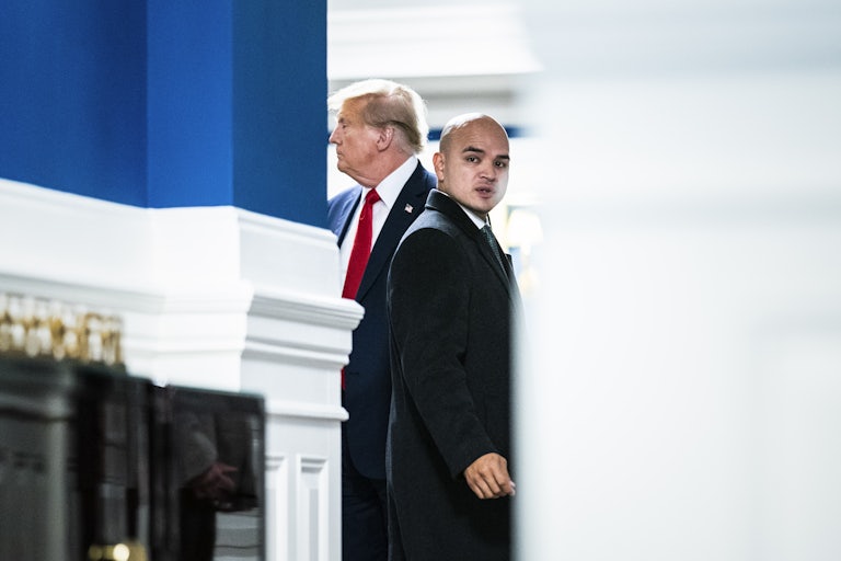 Donald Trump and Walt Nauta stand together